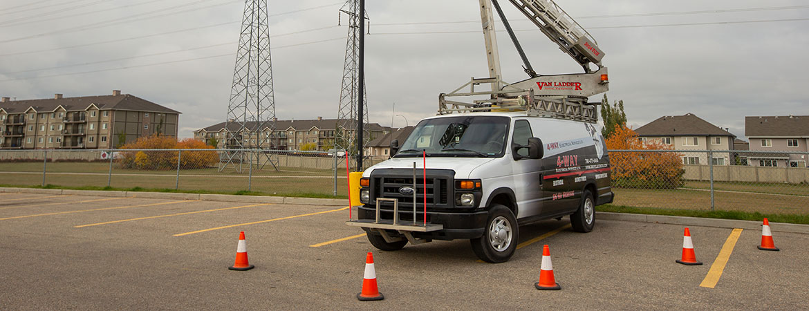 Traffic Cones protecting Van Ladder